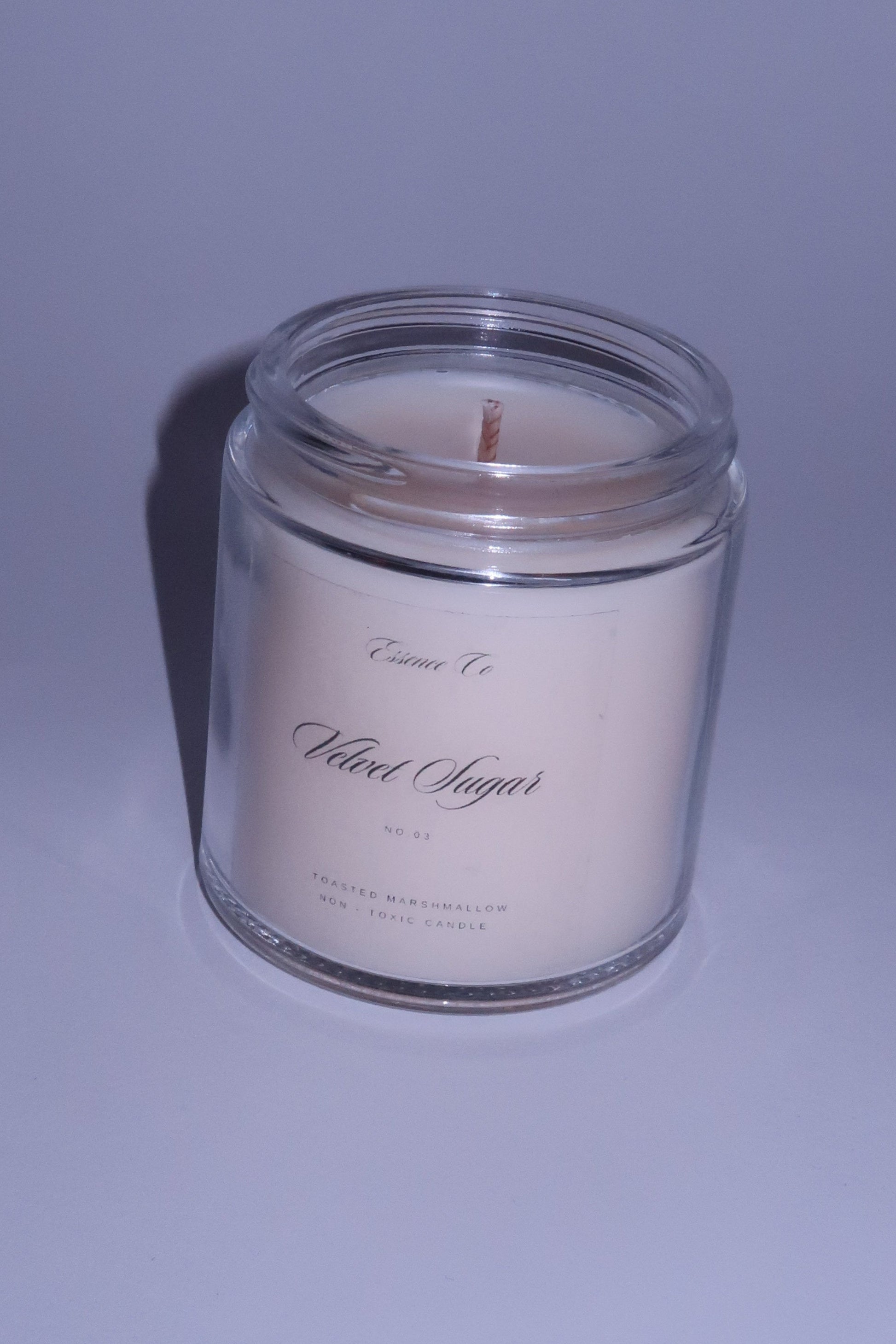 Candle in a glass jar on a gray background non toxic candle flash studio photography